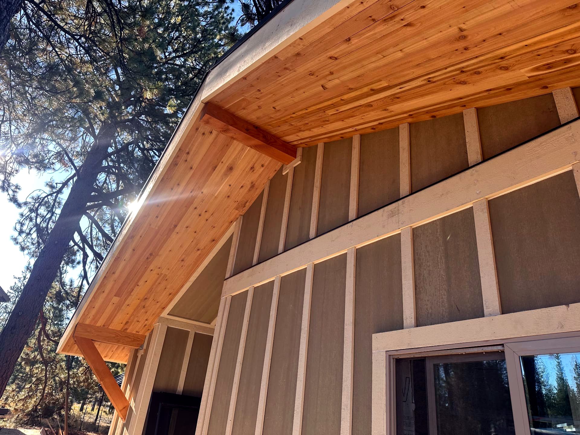 Exterior gable with board-and-batten siding and a tongue-and-groove cedar soffit